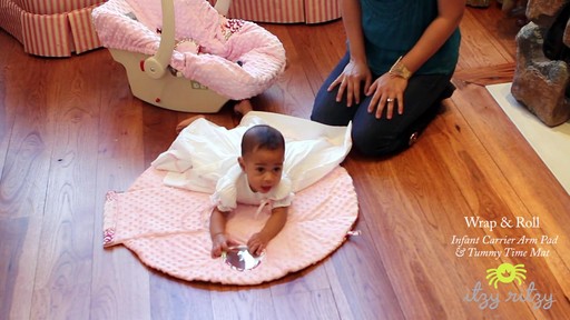 Itzy Ritzy Wrap & Roll Infant Carrier Pad and Mat - image 6 from the video